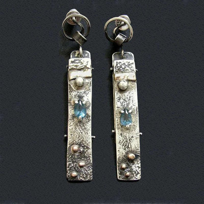 Handmade earrings made of blue stone